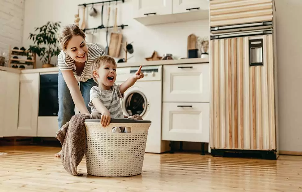 mom and son playing laundry